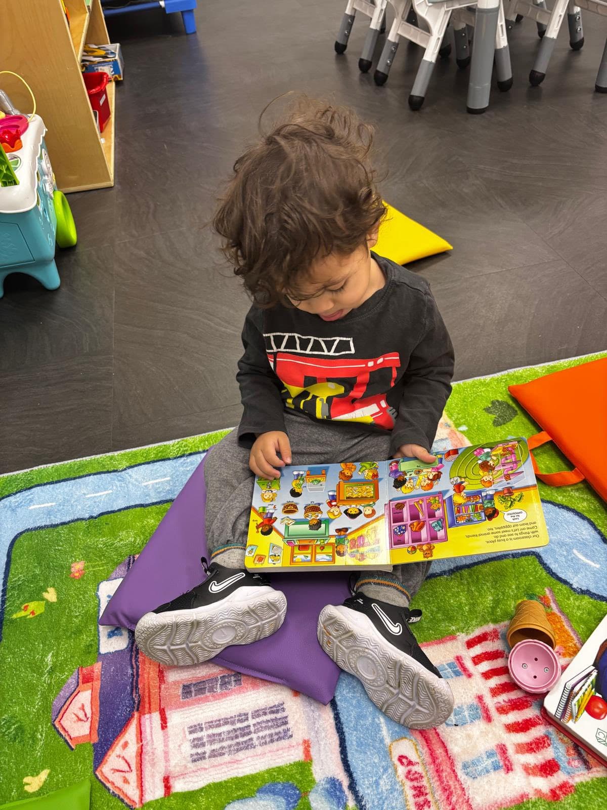 Child reading and learning at daycare